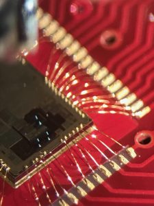 Ball bonds on chip and red PCB